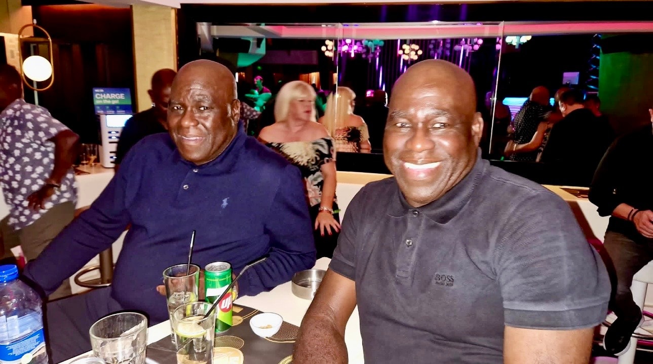 Three guests enjoying the evening under green lights at Sun & Soul Cyprus 2026